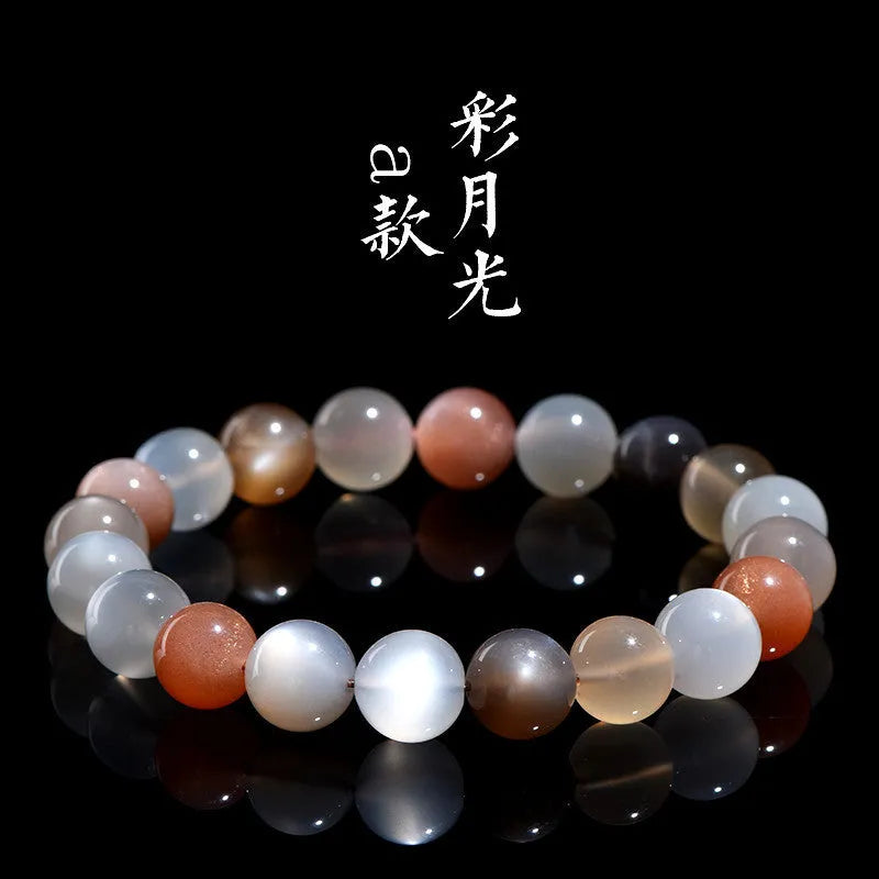 Natural colourful moon light moonstone duobao bracelet with 8mm beads on an adjustable band.