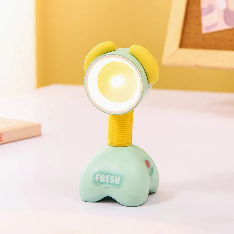 DIY magnetic cartoon small night lamp with multi-angle adjustable lighting on desktop