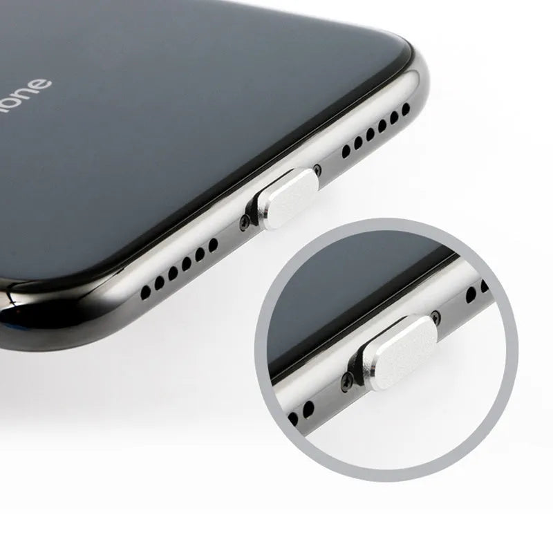 Aluminium alloy iPhone charging port dust plug in multiple colours including gold, silver, blue, red, grey, black, and rose gold.