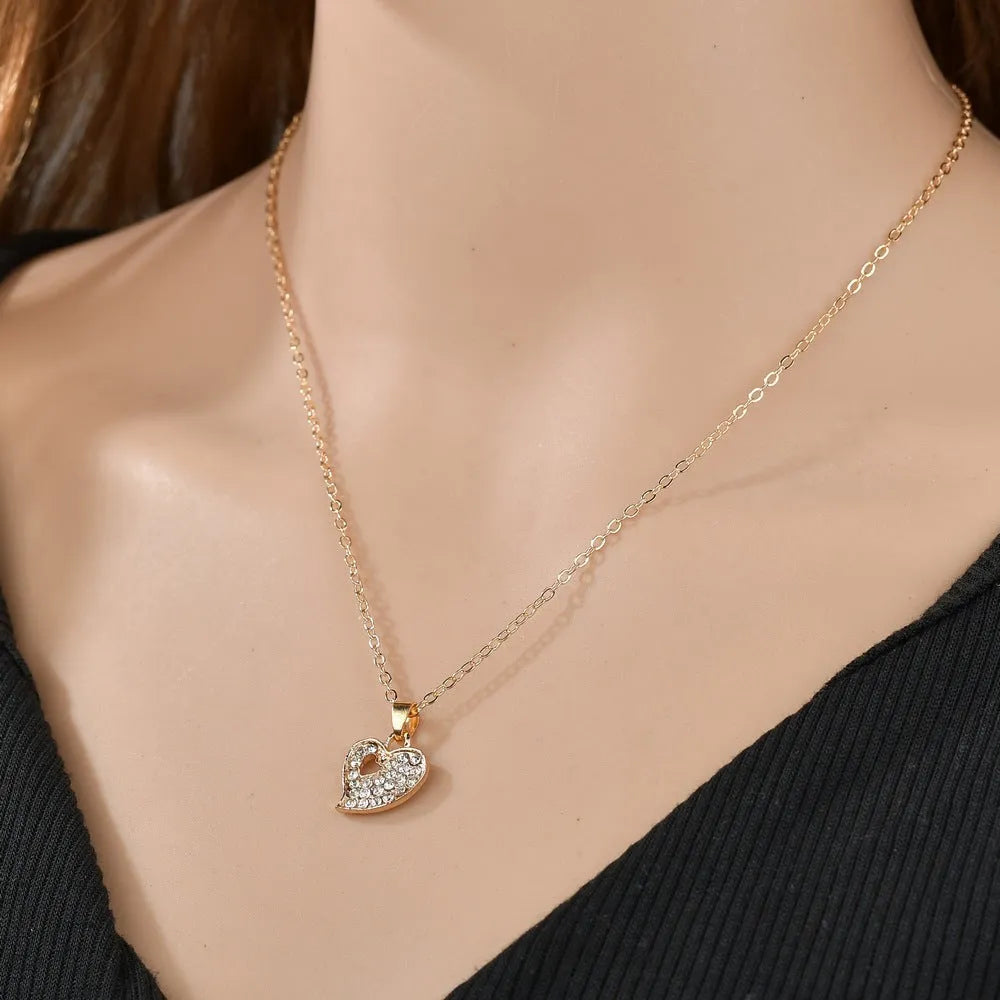 Gold-colour alloy jewellery set with love, water drop and bell patterns including earrings, decorative items and hand ornaments