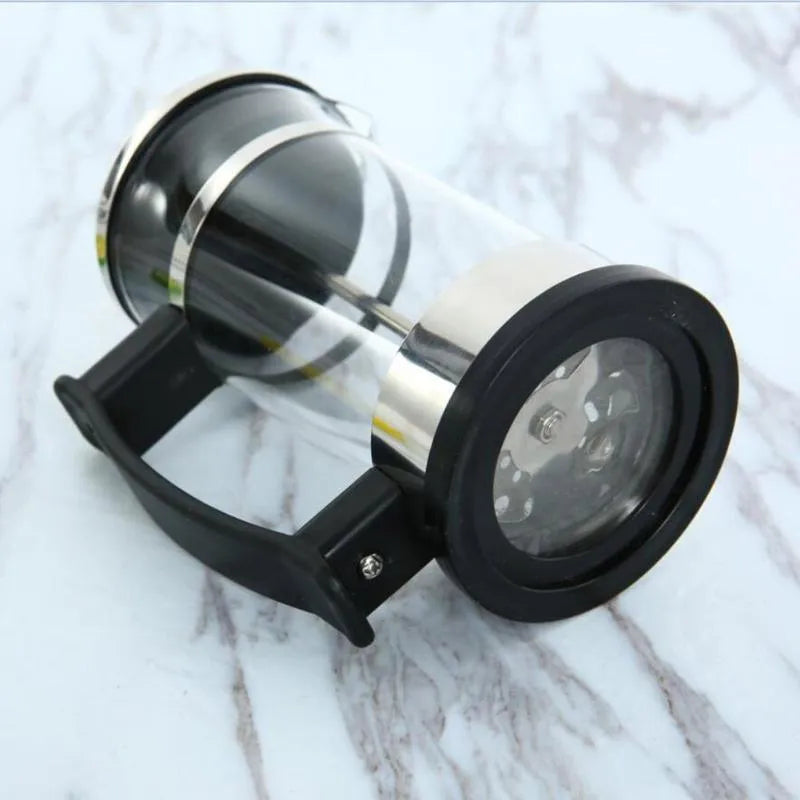 Small glass French press coffee maker with stainless steel plunger, shown with dimensions 10cm by 8cm by 17cm.