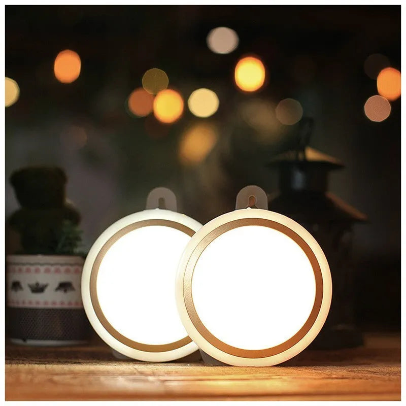 Circular white motion sensor LED light with 80mm diameter, shown mounted inside a wardrobe.