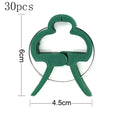 Green plastic and zinc plant fixing clips for supporting climbing tomato and cucumber vines.