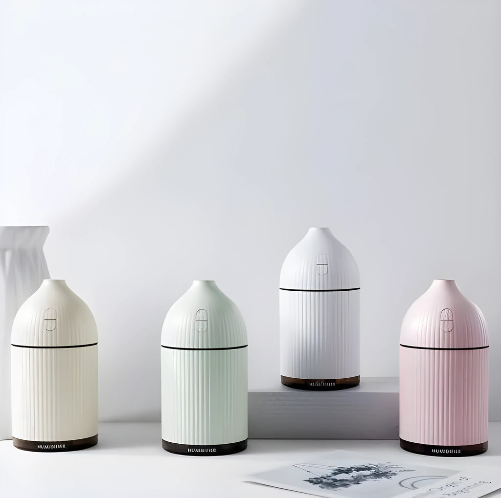 White ultrasonic aroma diffuser humidifier with LED light, measuring 80mm wide and 155mm tall.
