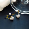 Heart-shaped pearl stud earrings with electroplated alloy construction and Korean-style design