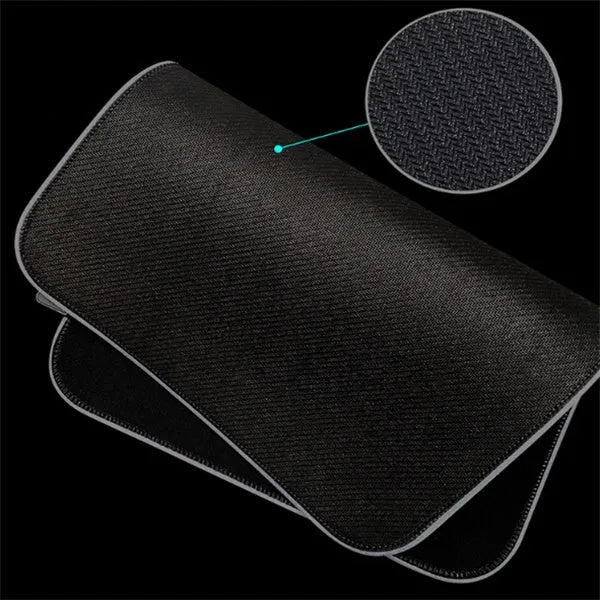 Luminous table mat gaming mouse pad with RGB illumination and non-slip rubber base in black on a wooden desk