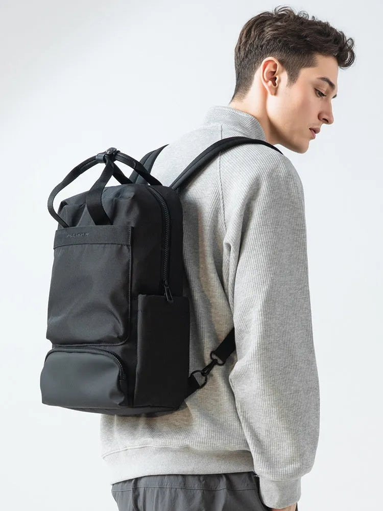 Elegant black Oxford cloth computer backpack showing main compartment and straps