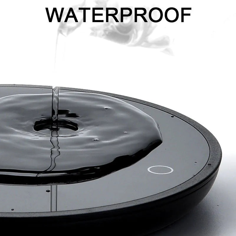 Black coffee cup warmer with 12 cm tempered glass heating surface and ABS plastic base