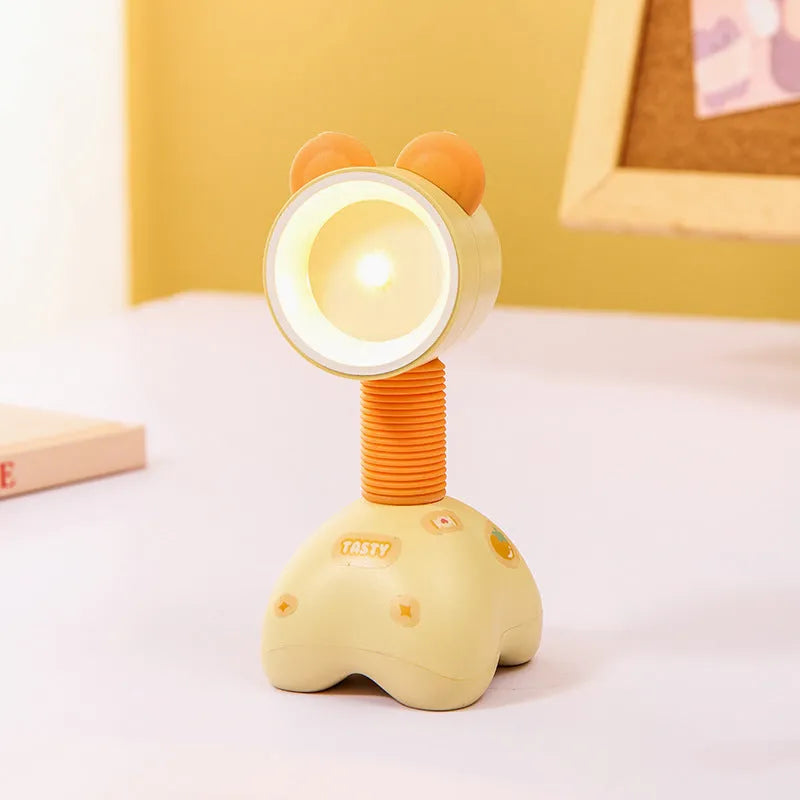 DIY magnetic cartoon small night lamp with multi-angle adjustable lighting on desktop