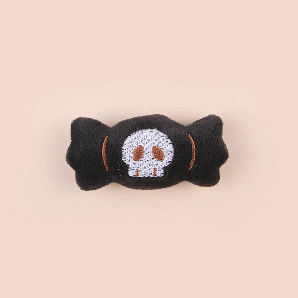 Small plush cat teaser wand with candy and skull designs for indoor play