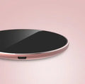 Ultra-thin aluminium wireless charger in metallic finish showing micro USB port