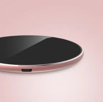 Ultra-thin aluminium wireless charger in metallic finish showing micro USB port