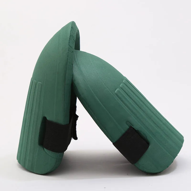 A pair of simple black EVA foam knee pads for gardening, showing their rectangular shape and thickness.