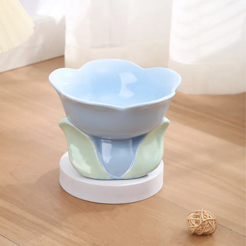 Blue floral patterned ceramic raised bowl for cats or small dogs on a non-slip base.