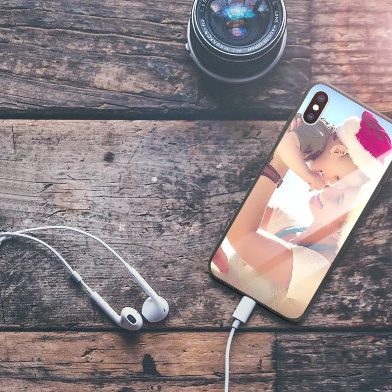Patterned iPhone case with raised edges on a table next to an iPhone.