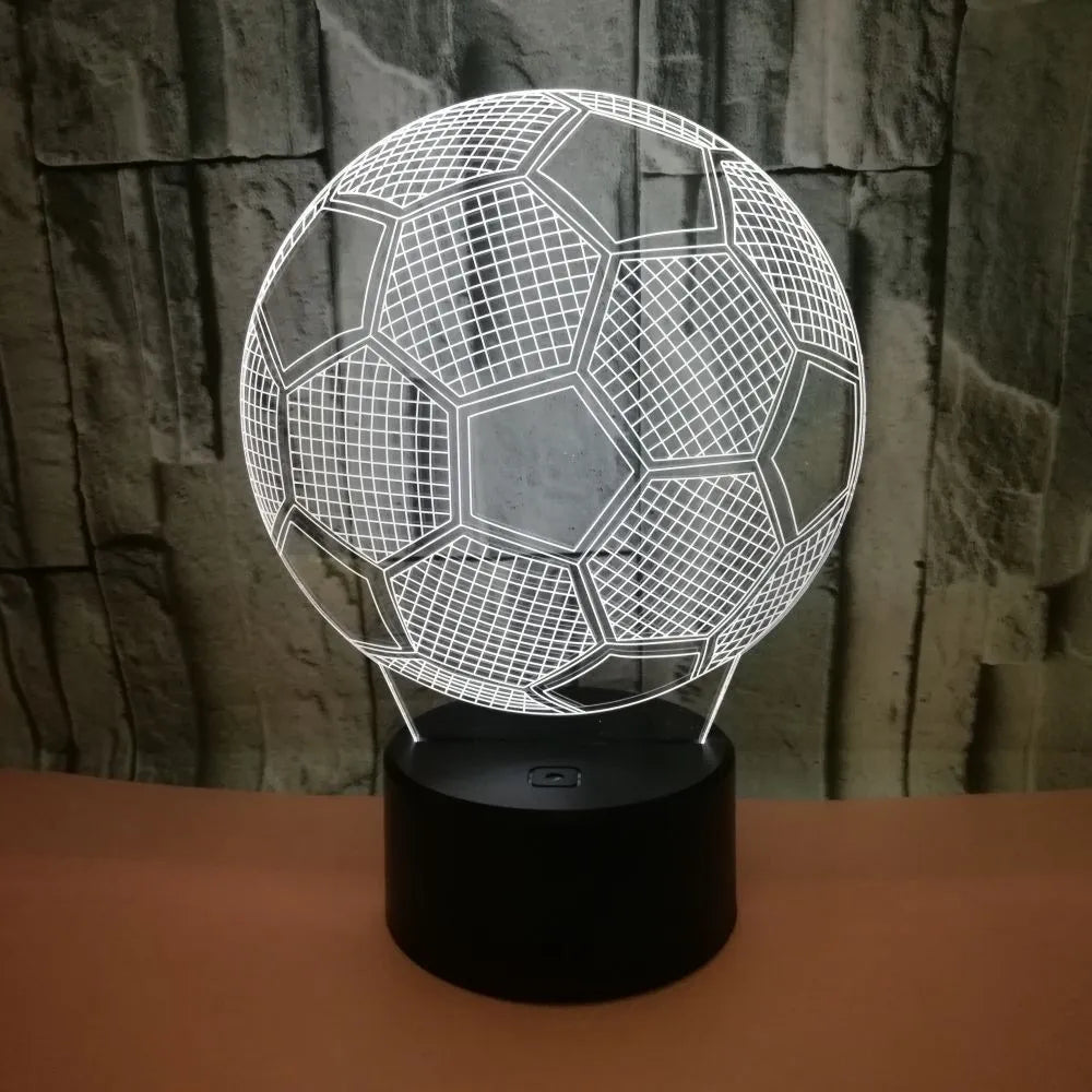 3D football-shaped night light showing multicolour illumination on acrylic surface