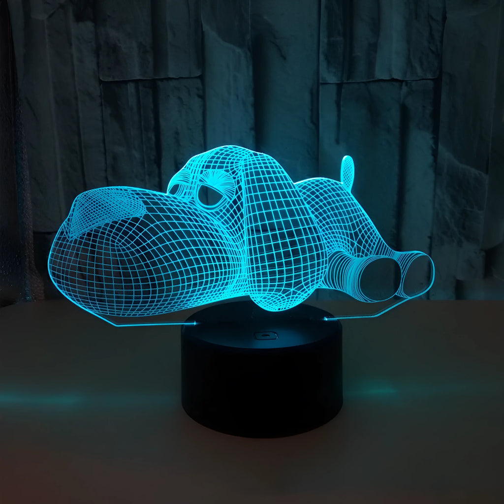 Dog-shaped desktop lamp glowing in blue, with touch button and USB cable.