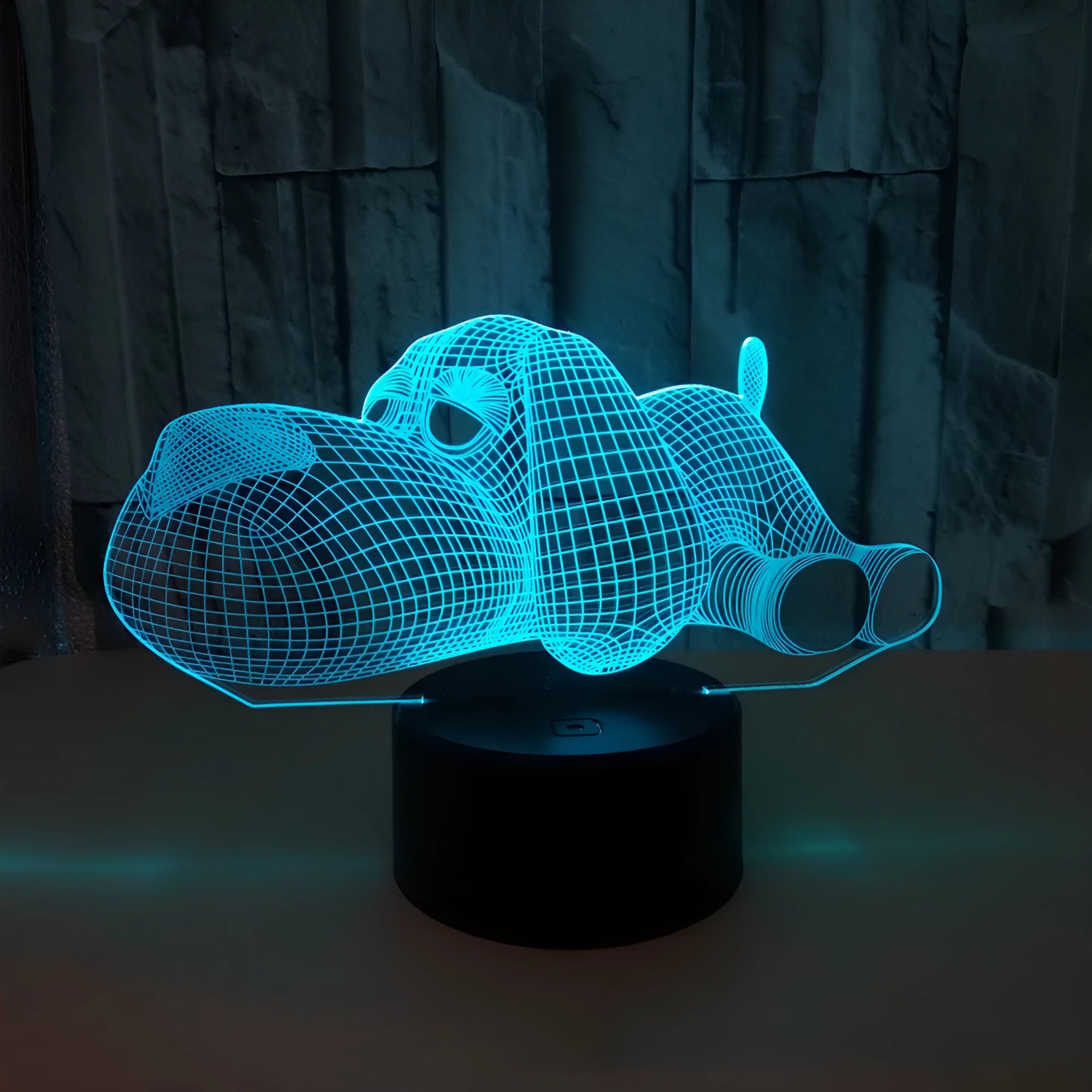 Dog-shaped desktop lamp glowing in blue, with touch button and USB cable.