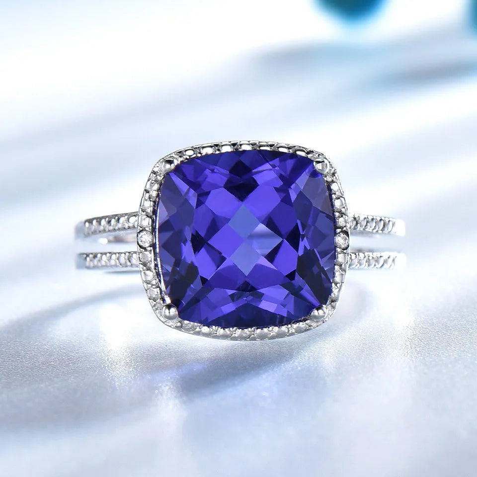 Women's sterling silver ring with blue tanzanite gemstone showing silver band and stone setting