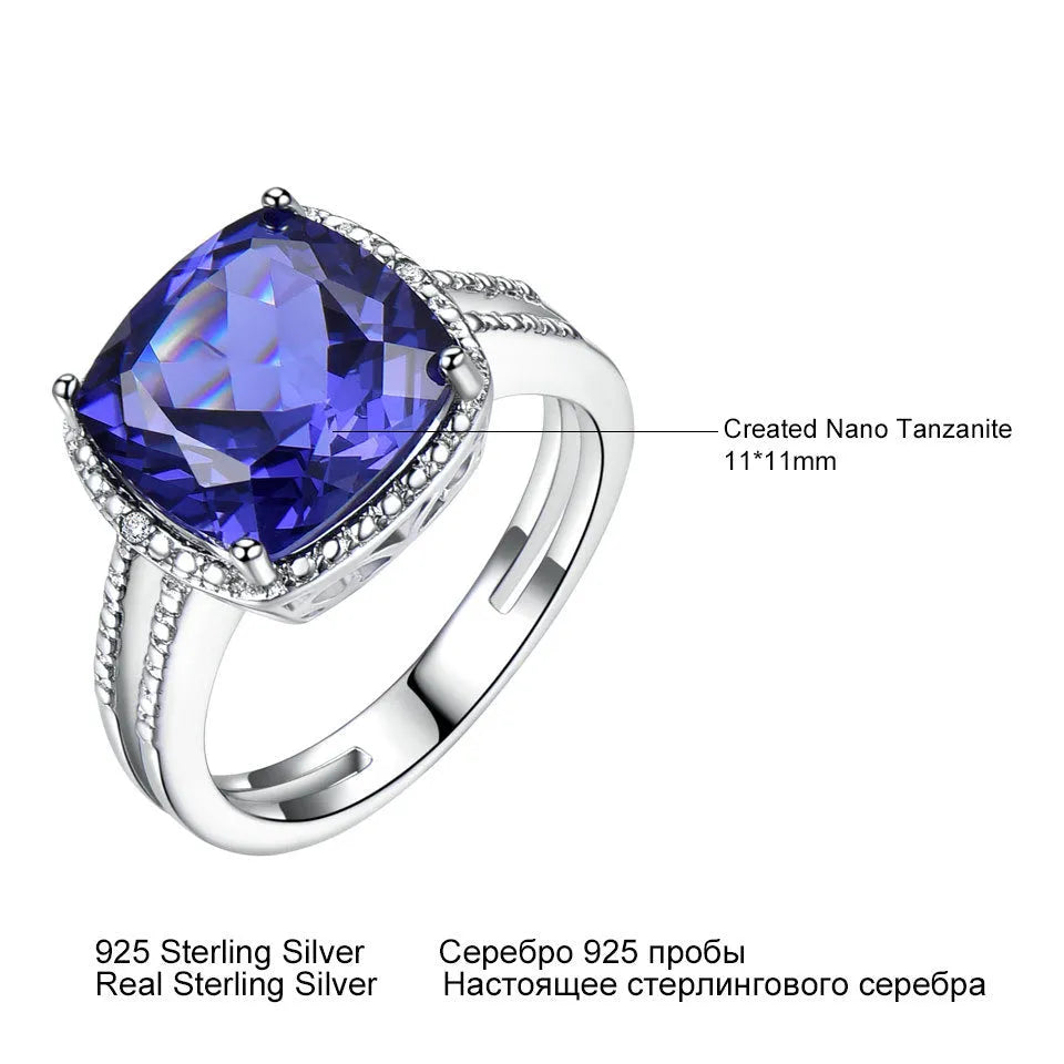 Women's sterling silver ring with blue tanzanite gemstone showing silver band and stone setting