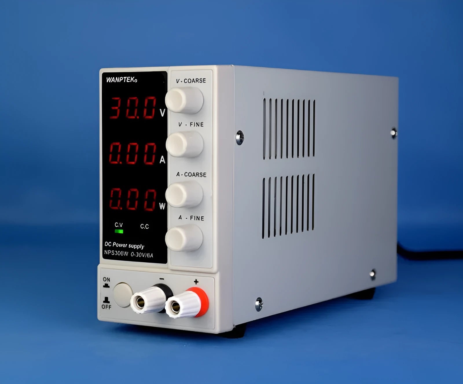 White NPS605W adjustable DC bench power supply with digital displays for voltage and current settings.