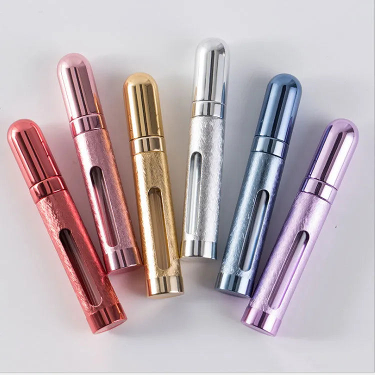 Slender aluminium travel perfume bottle with glass liner in a choice of six colours, shown next to a ruler showing 115mm length.