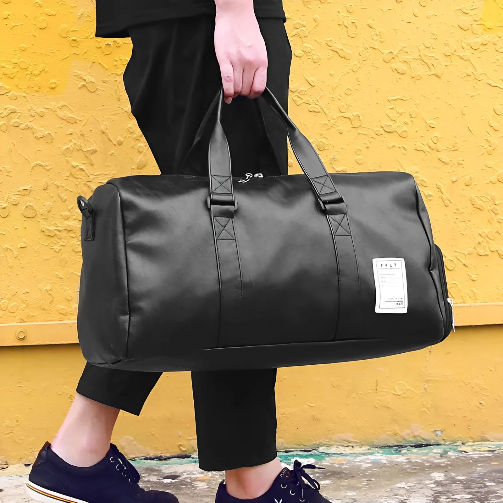 Black waterproof sports bag with diagonal straps and separate shoe compartments in two size options