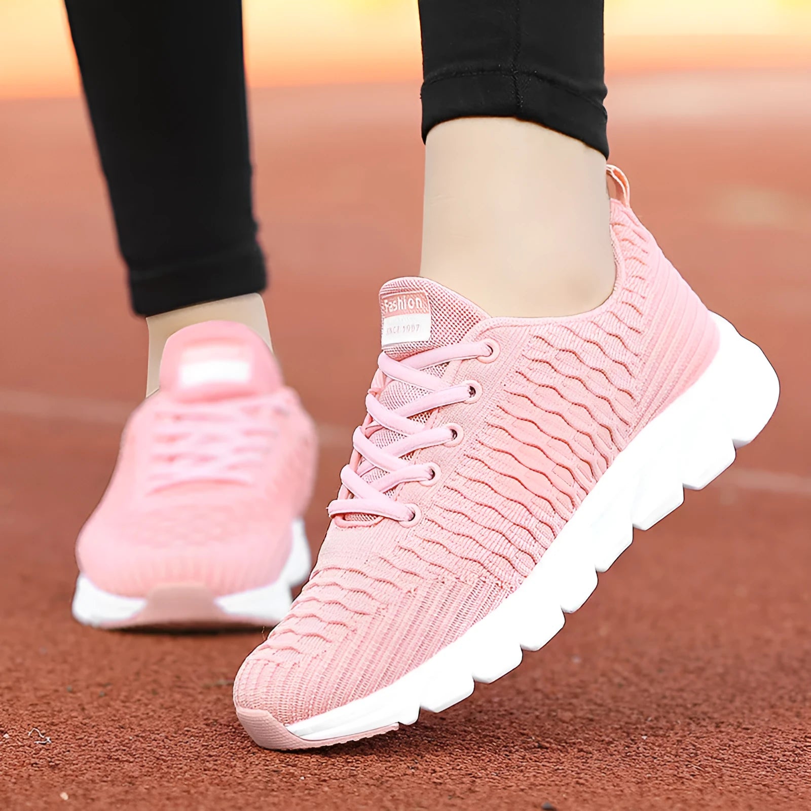 Women's running shoes with mesh upper in black, pink, or white colour options