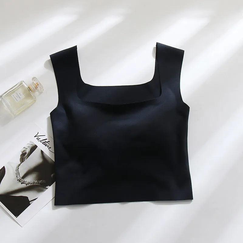 Seamless nylon sling vest for women with built-in thin full cup, shown in a light colour.