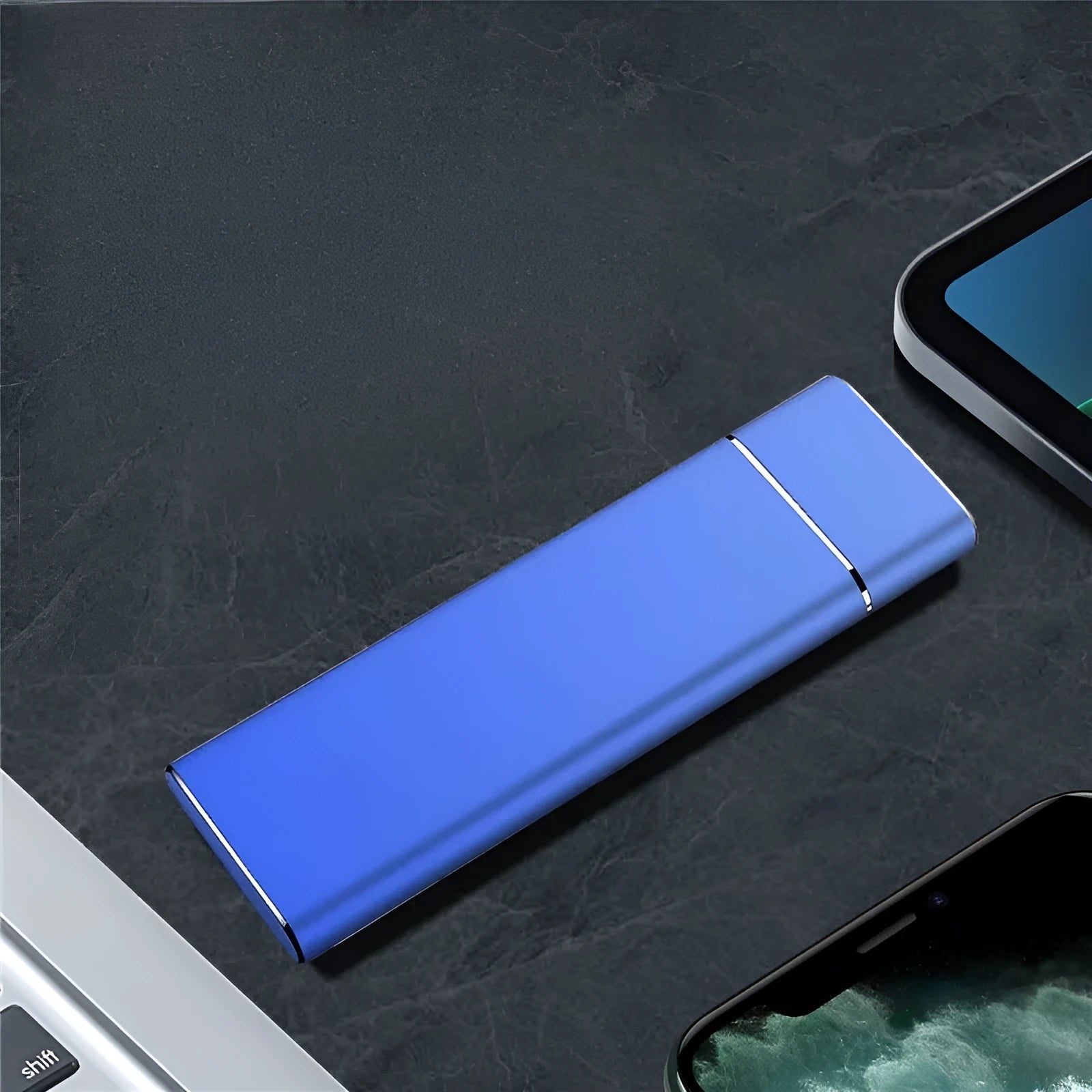 Sapphire blue metal external solid state hard disk with USB cable on a white surface