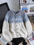 Women's loose-fit jacquard knit sweater coat in beige, shown with long sleeves.
