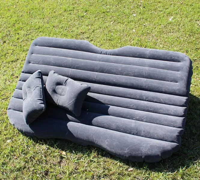 Universal inflatable car bed with flocking material, shown with pump, pillows, and storage bag.