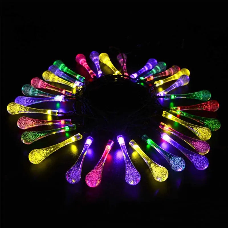 Solar-powered outdoor LED string lights with water drop pendants on 6.5 metre cable