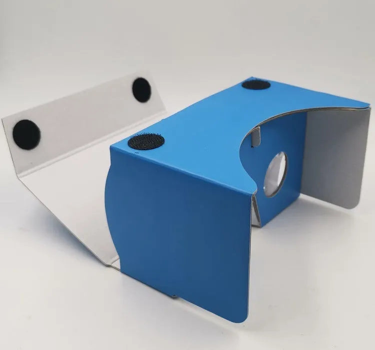 Pink and white VR cardboard glasses viewer for 6-inch smartphones with adjustable head strap.