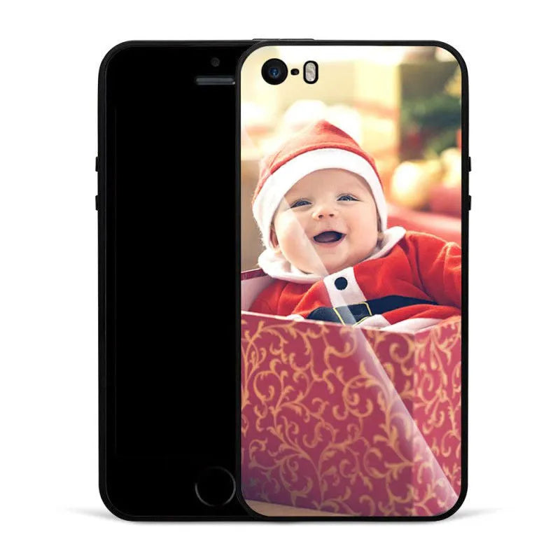 Patterned iPhone case with raised edges on a table next to an iPhone.