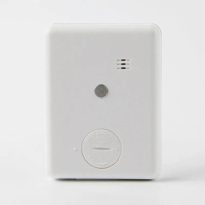Black and white digital kitchen timer with magnet back, flip-out stand, and large LCD display.
