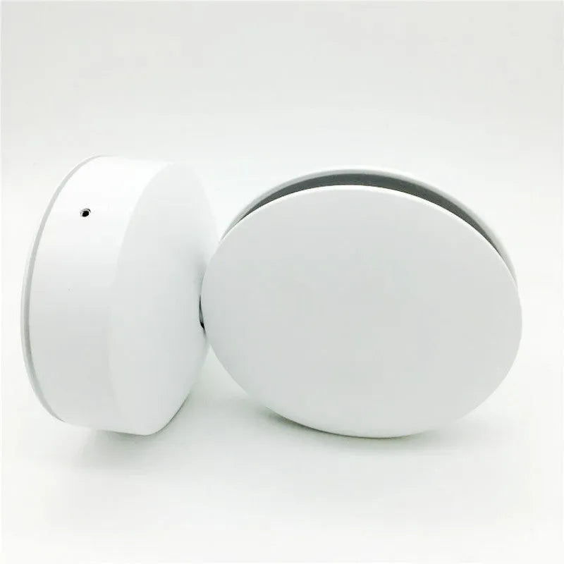 Modern aluminium LED bar wall lamp with glass lens, shown in a corridor setting.