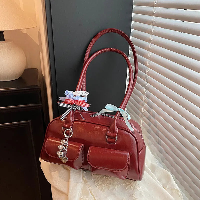Retro pillow-shaped women's handbag in PU leather with double shoulder straps