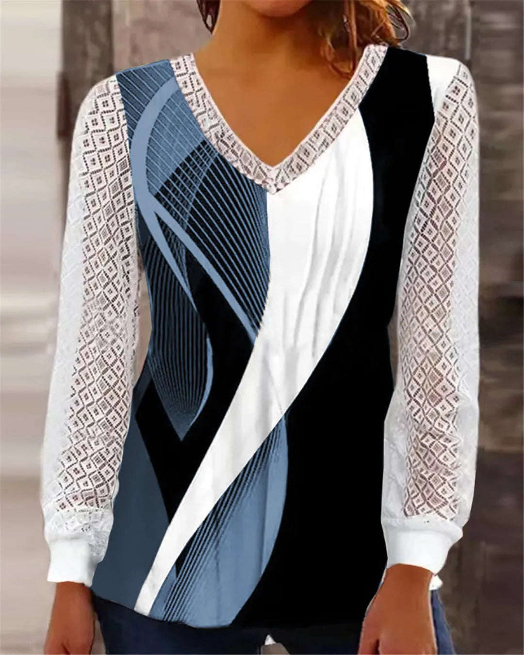 Loose V-neck women's top with hollow-out lace print design in polyester fabric