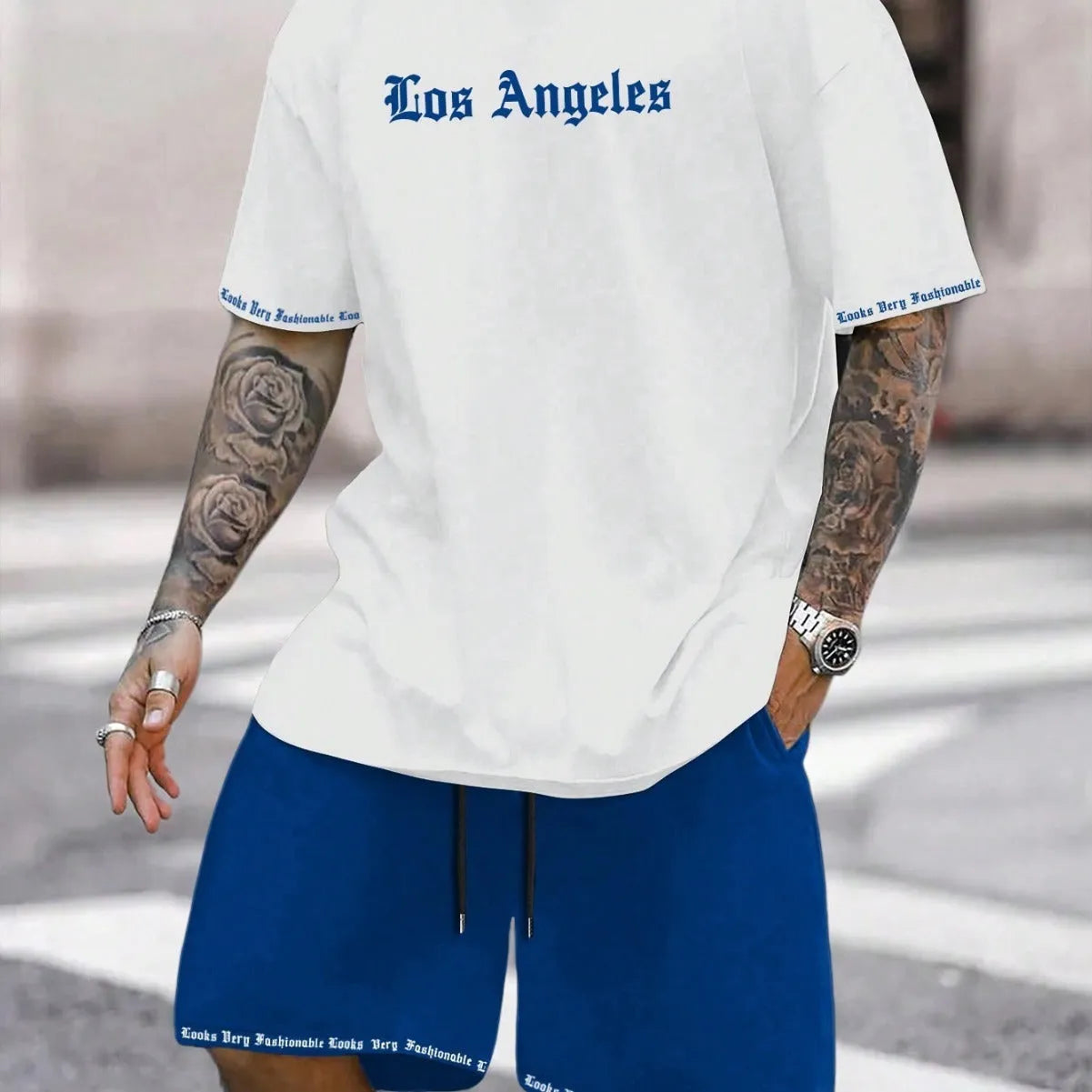 Sports-style short sleeve shirt and matching shorts set in a printed pattern, shown in colour G23P1573.