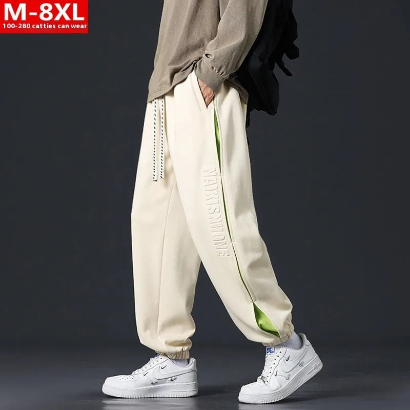 Men's loose-fit cotton trousers with ankle banded design in grey green colour