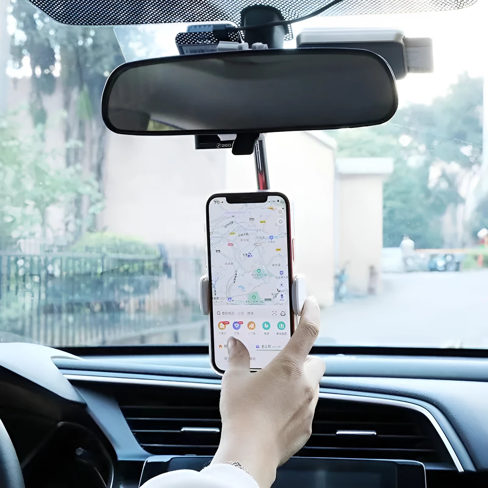 Black ABS plastic smartphone bracket mounted on car rearview mirror holding mobile phone