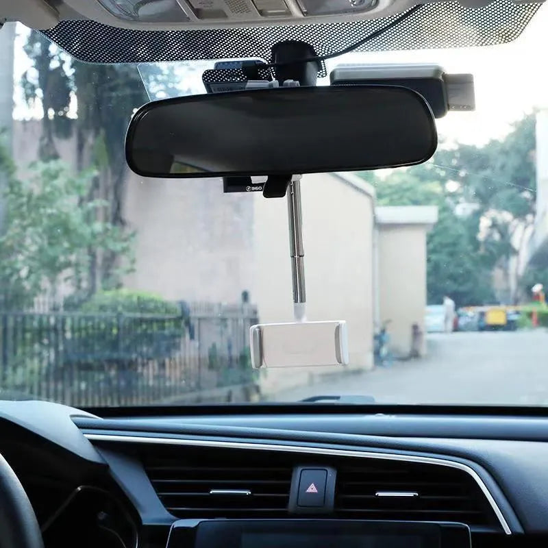 Black ABS plastic smartphone bracket mounted on car rearview mirror holding mobile phone