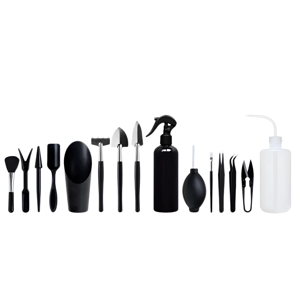 Black mini garden hand tools set for succulents with tweezers, shovels, watering bottle, brushes, and a grey cushion.