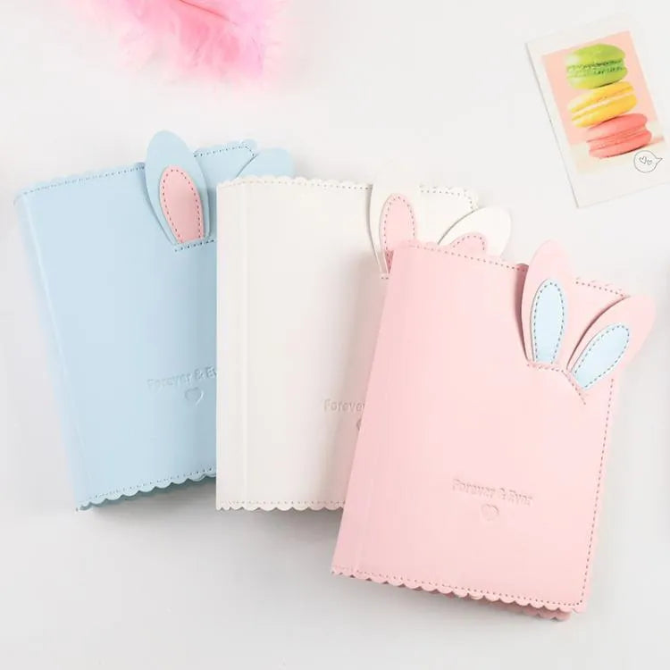 Cute bunny style mini photo album in pink, blue, or white, showing 3-inch size and loose-leaf pages.