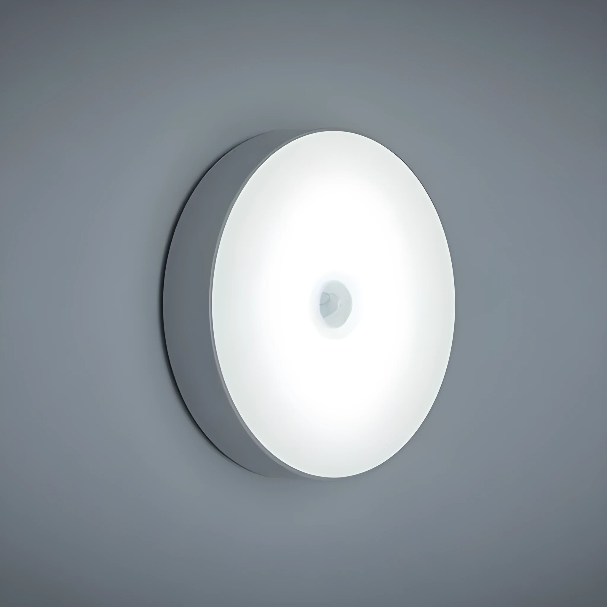 White circular motion sensor night light with USB charging port showing 86mm diameter dimensions