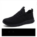 Men's black and white mesh sneaker with lace-up closure and round toe for casual outdoor wear