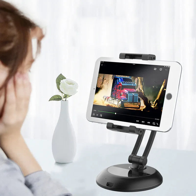 Portable multifunctional mobile phone support shelf in black on a desk holding a smartphone