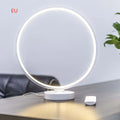 White Full Moon Lamp table lamp with remote control on wooden surface