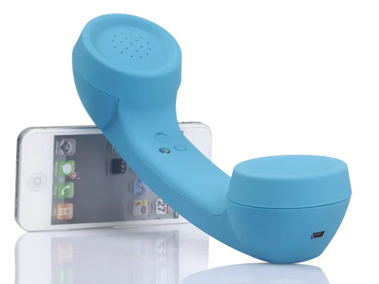 Retro-style Bluetooth wireless headset microphone in hanging-ear design, shown in multiple colour options.